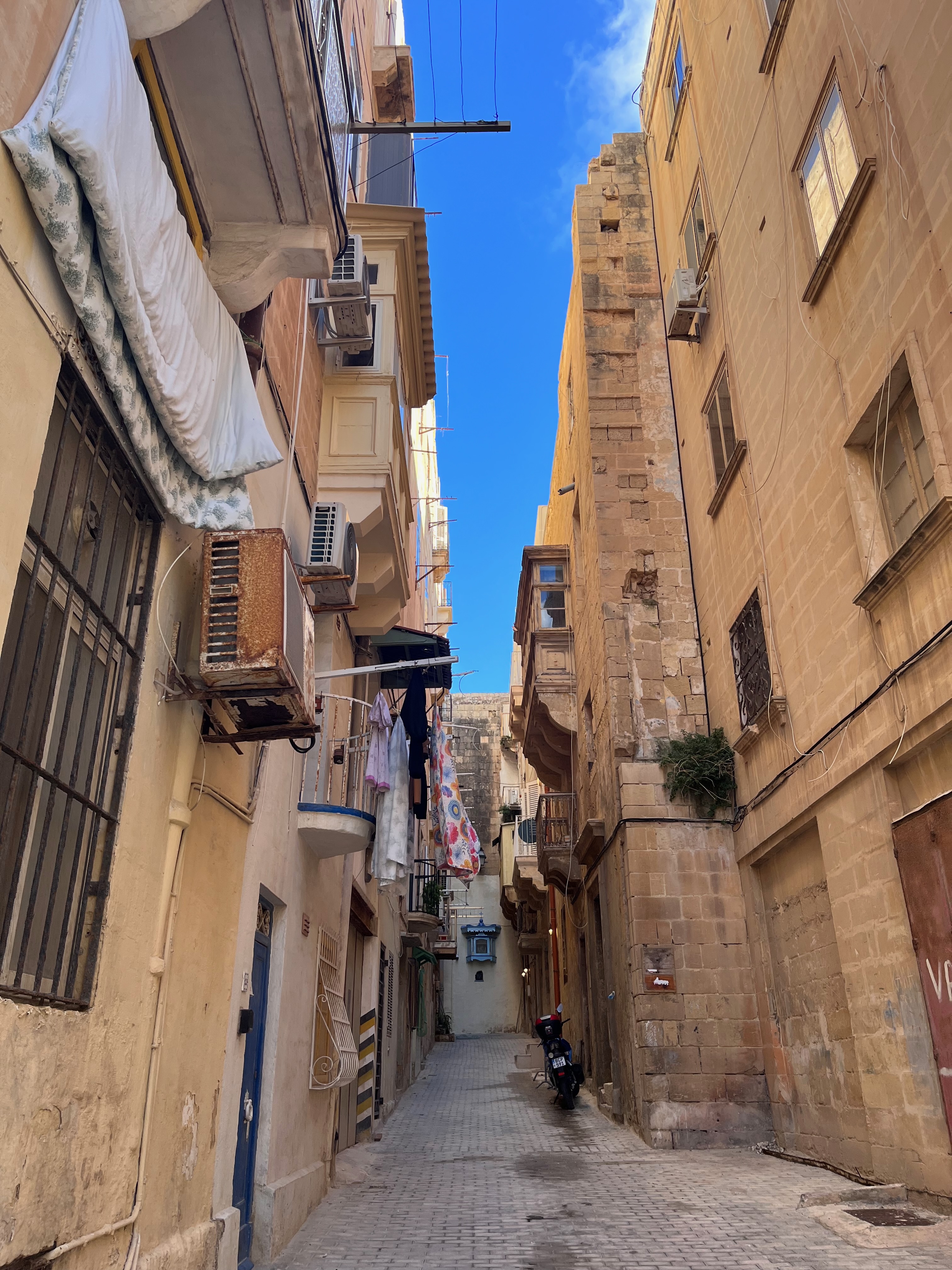 Old city in Valletta. Narrow street on a sunny December afternoon. 